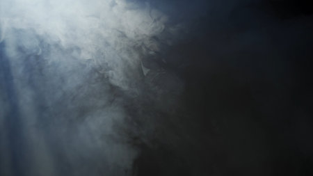 Soft diffused rays of light cut through the hazy darkness.の写真素材