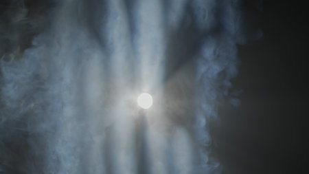 Bright liner white spotlights rays of professional lighting equipment flashing in darkness on black background smoke streaming through, close up.の写真素材