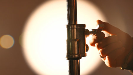 Professional studio for photo and video production filming with modern lighting equipment, close up shot of details, photographer fixing stand or monopod.の写真素材