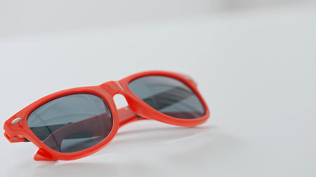 Bright Red Sunglasses on a White Surface