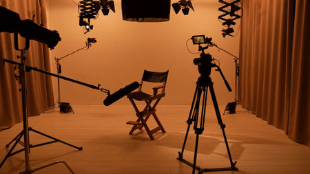 Studio for photo video production filming with lighting equipment, cyclorama and camera, director chair stand in the middle.の写真素材