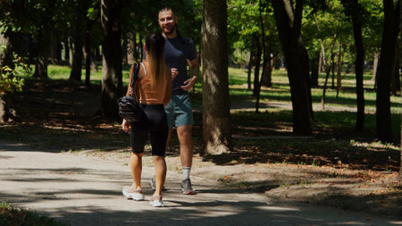 Active young couple in sportswear enjoying an outdoor walk.の写真素材