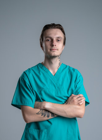 Confident Male Healthcare Professional in Scrubsの写真素材