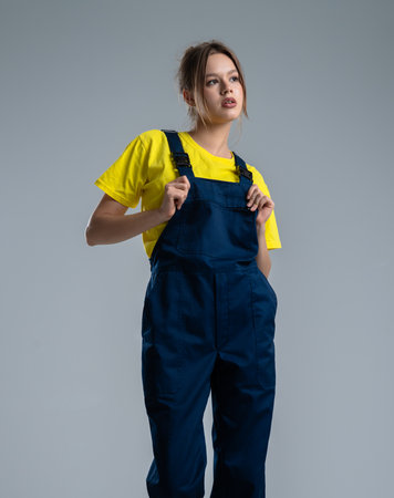 Young Worker in Professional Overallsの写真素材