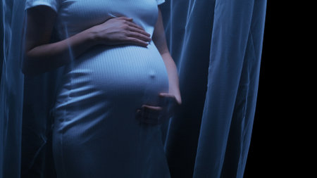 Artistic shot of a young pregnant woman using a transparent fabric