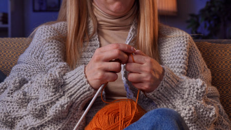 Evening Relaxation With Knitting and Creativity Among Friends on a Cozy Autumn Nightの写真素材