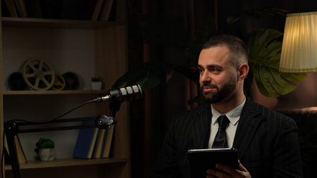 Influencer expert shares his thoughts in a podcast loft studio settingの写真素材