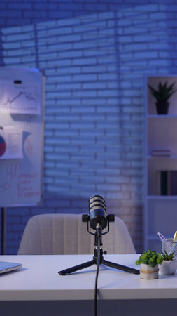 A cozy podcast studio with creative visualsの写真素材