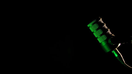 Studio microphone with dramatic green lightingの写真素材