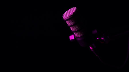 Studio microphone with dramatic purple lighting