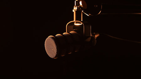 Professional studio microphone in warm cinematic lightingの写真素材
