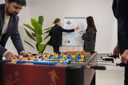 Office Team Collaborating on Innovative Strategy While Enjoying Break