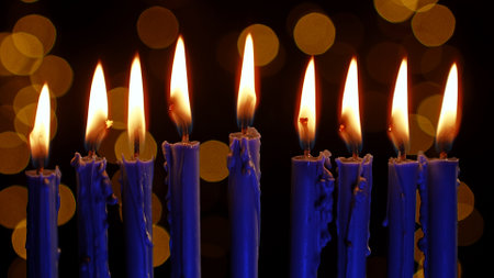 Celebrating Hanukkah With a Vintage Menorah and Festive Sufganiyah Under Candlelightの写真素材