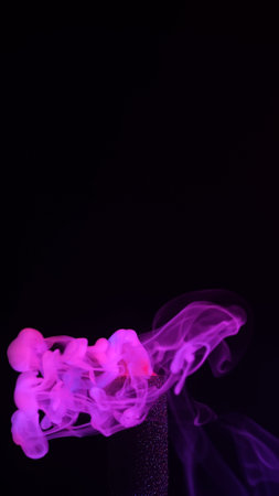 Ethereal Pink Smoke Flowing in Dark Background Artの写真素材
