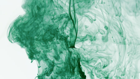 Vibrant Green Ink Swirling in Water: Abstract Fluid Dynamicsの写真素材