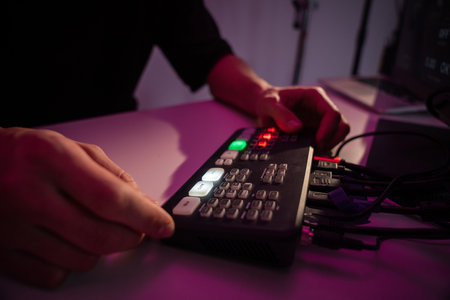 Person Operating Video Switcher in Control Roomの写真素材
