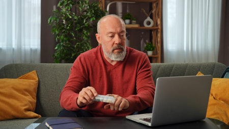 Senior Man Checking Medication Instructions During Online Consultation