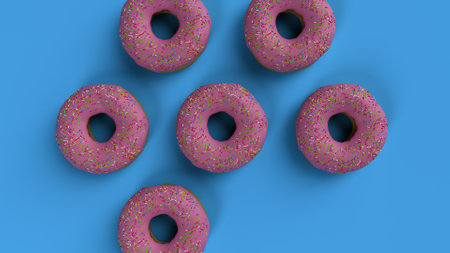 Delicious Pink Frosted Donuts with Colorful Sprinklesの写真素材