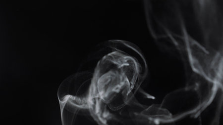 Engaging Visual of Smoke Swirling on Dark Backgroundの写真素材