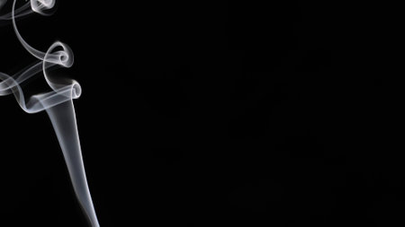 Engaging Visual of Smoke Swirling on Dark Backgroundの写真素材