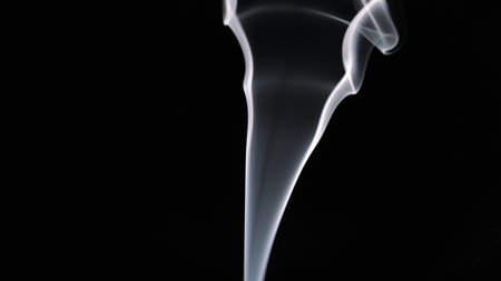 Engaging Visual of Smoke Swirling on Dark Backgroundの写真素材