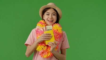 Smiling Woman with Tickets and Hat Ready for Travel Adventureの写真素材