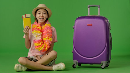 Excited Traveler Ready for Vacation with Tickets and Luggageの写真素材