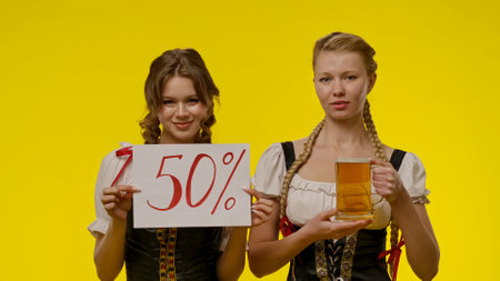 Two women in traditional attireの写真素材