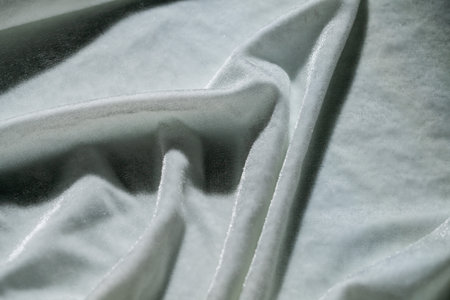 White Textured Fabric with Sparkling Detailsの写真素材