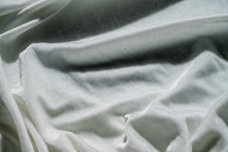 White Textured Fabric with Sparkling Detailsの写真素材