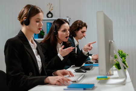 Customer Service Representatives Working in Modern Office Environmentの写真素材