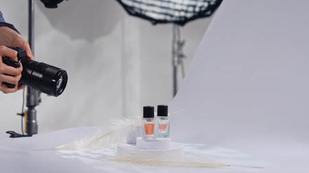 Professional Perfume Photography in Studio Setting with Cameraの写真素材