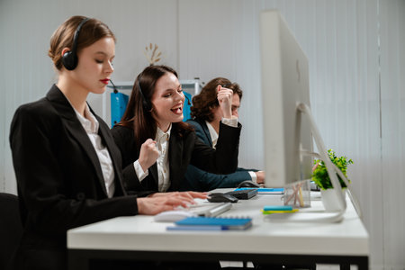 Customer Service Representatives Working in Modern Office Environmentの写真素材