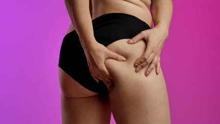 Woman Checking Thigh and Skin Texture in Underwear