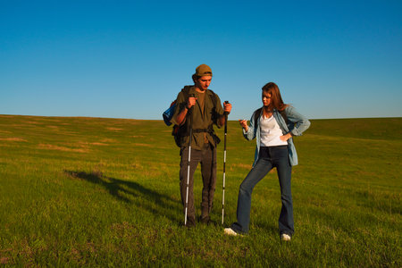 Hikers Enjoying a Scenic Landscape in the Sunshineの写真素材