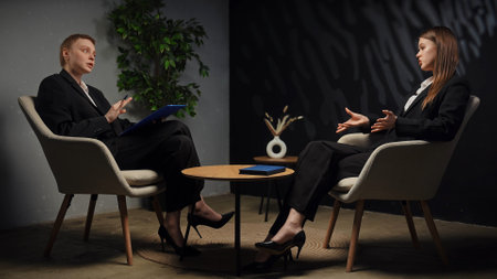 Professional Business Meeting Between Two Executive Professionals Discussing Strategiesの写真素材