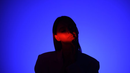 Mysterious Person in Dramatic Blue and Red Lighting Effect