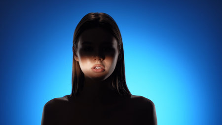 Captivating Portrait with Dramatic Shadow Play and Light Beam