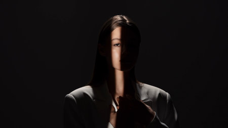 Portrait Photography with Dramatic Shadows and Light Beamの写真素材