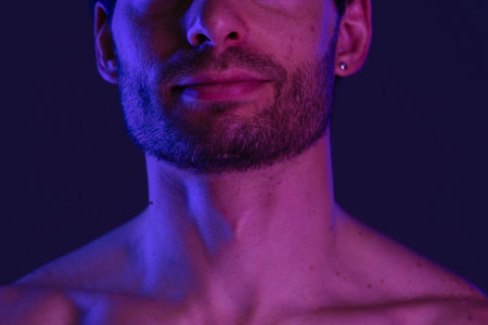Portrait of a Man with Beard under Neon Lightsの写真素材
