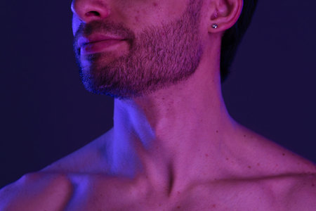 Portrait of a Man with Beard under Neon Lightsの写真素材