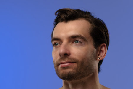 Portrait of a Man with Beard on a Blue Background