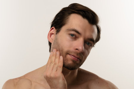 Portrait of a Man with Short Hair and Earringsの写真素材