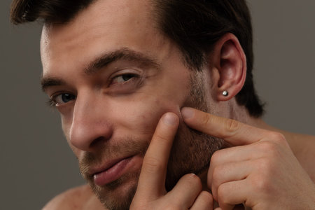 Portrait of a Man with Short Hair and Earringsの写真素材