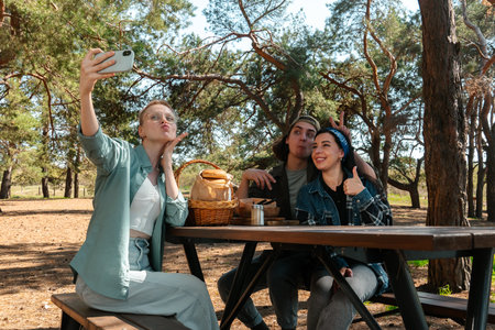 Friends Having Fun Taking a Selfie in the Parkの写真素材