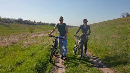 Adventure of Two Bikers Exploring Green Nature Trails