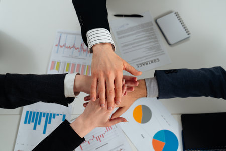 Team Collaboration with Diverse Hands over Business Documents