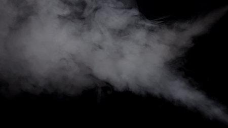 Thick Billowing Smoke on a Dark Background Sceneの写真素材