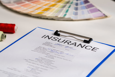 Insurance Document with Spools of Thread and Color Swatches