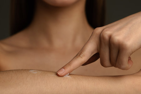 Applying Moisturizing Cream on Skin for Healthy Hydrationの写真素材